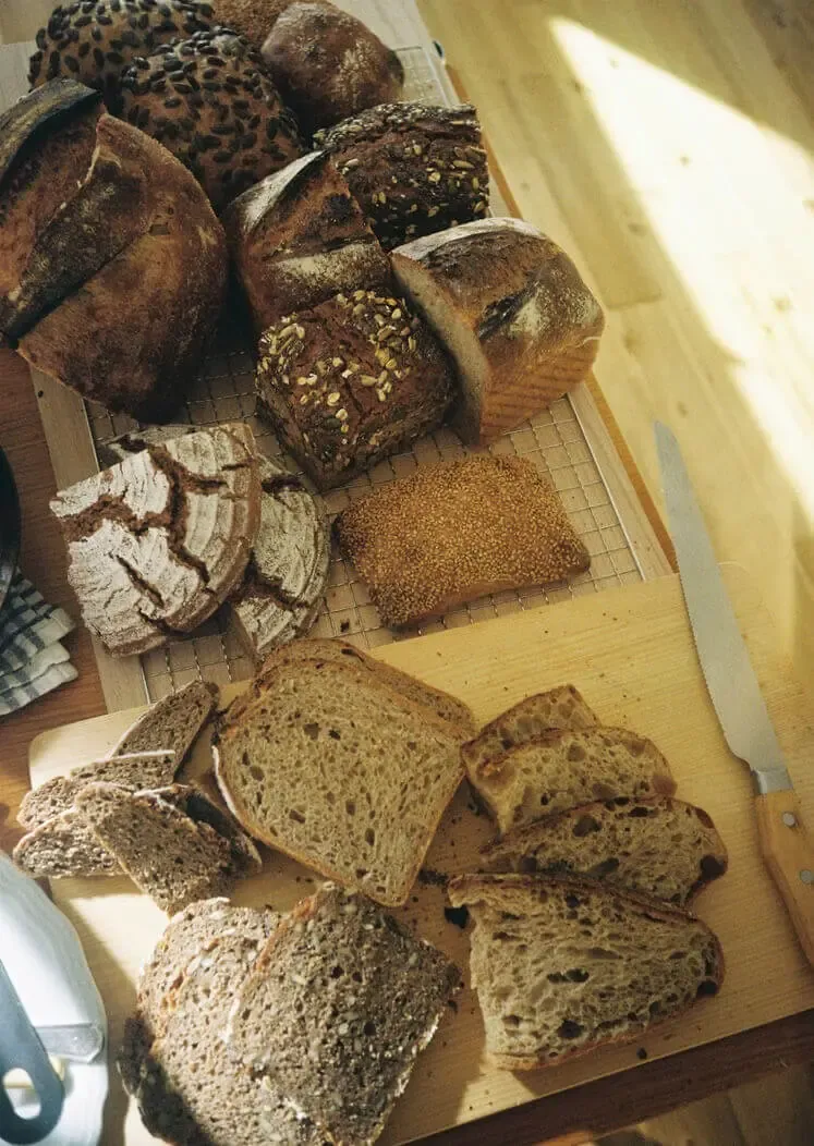 Fresh sourdough loaves displayed on the bakery counter