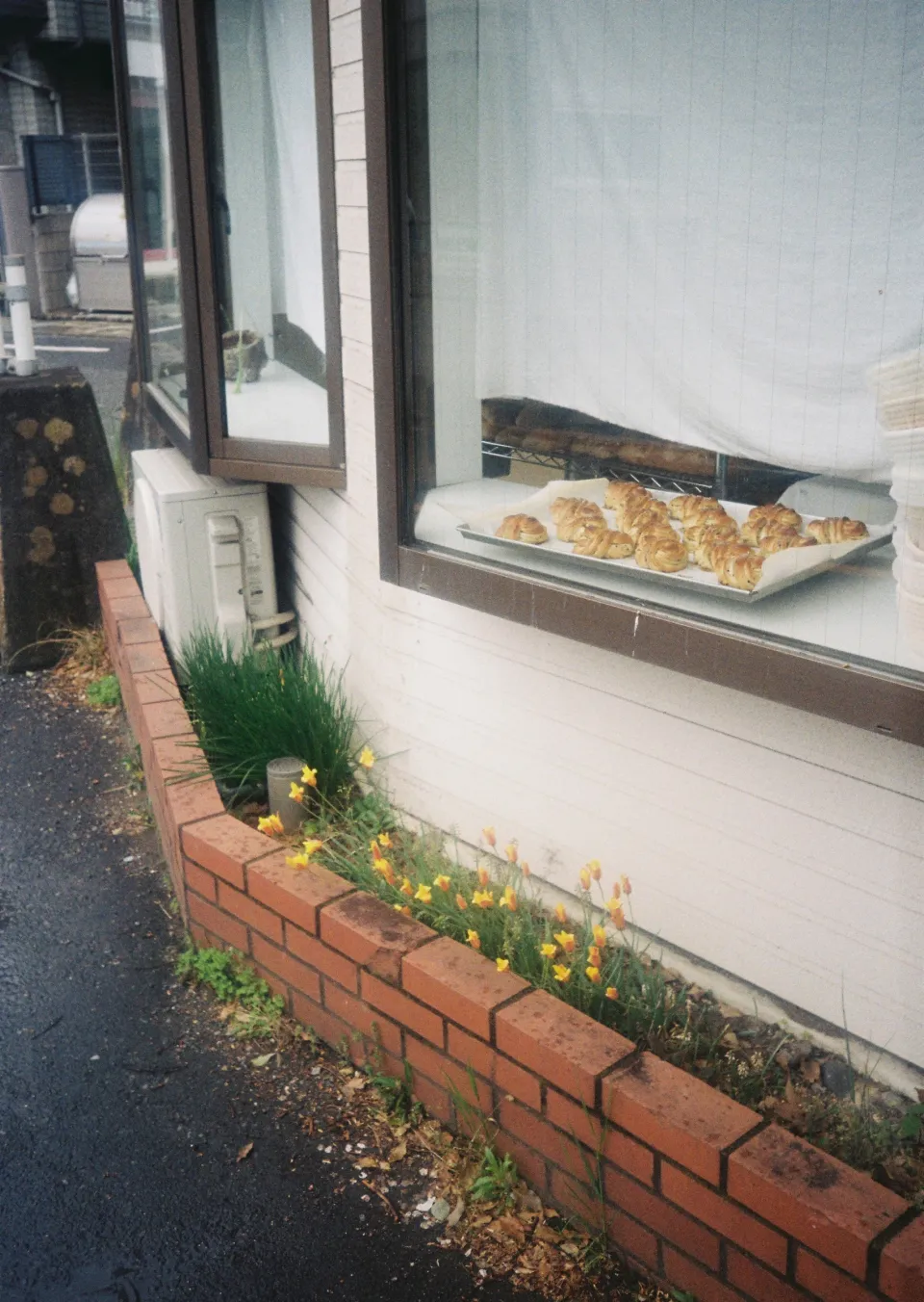 Fresh pastries cooling in Pide's window above a flower bed
